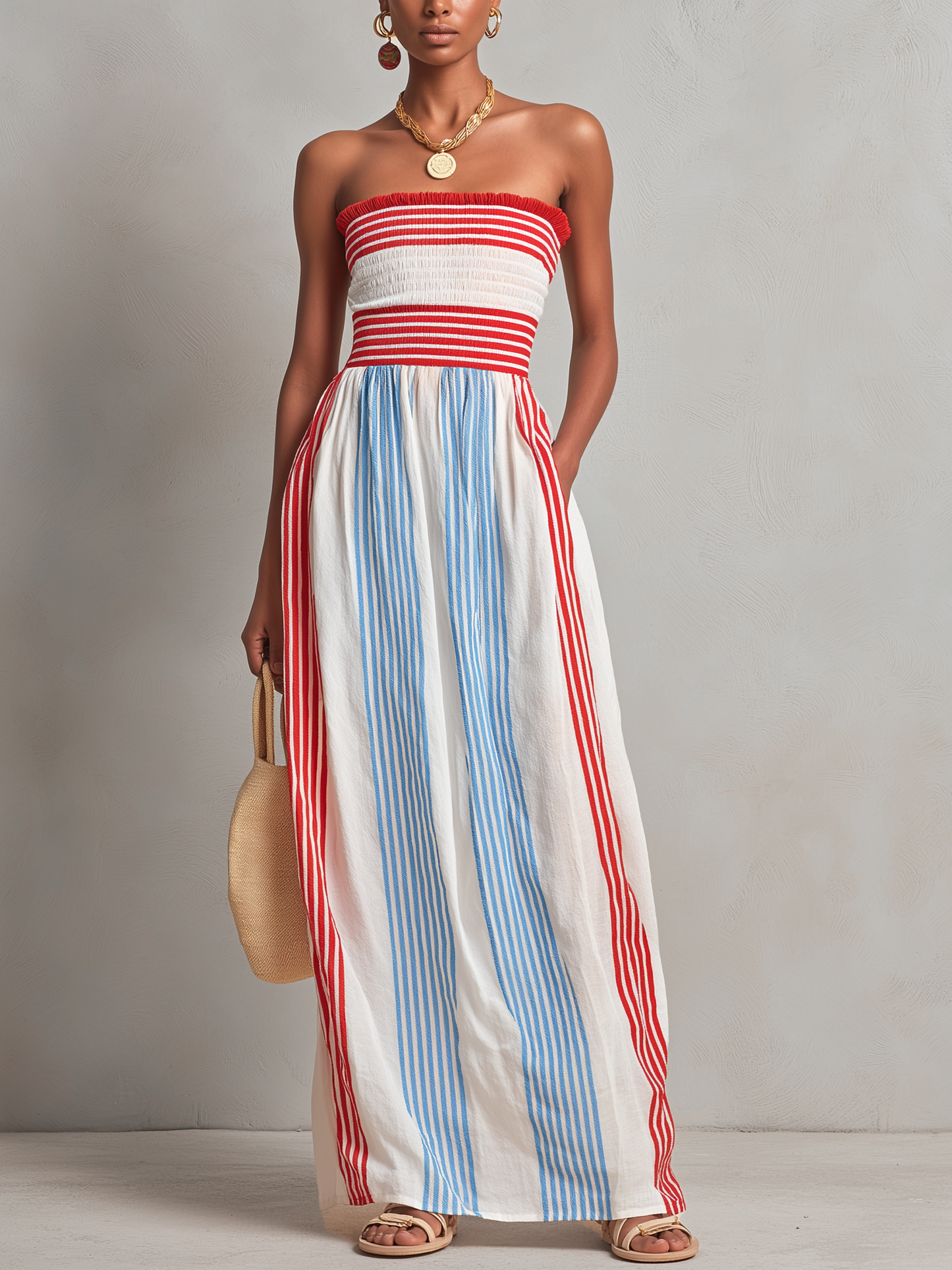 Estrella · Vestido maxi sin tirantes a rayas rojas y azules con fruncido