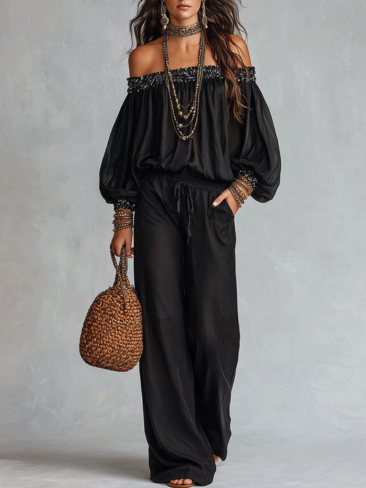 Daria | Conjunto compuesto por un top negro con hombros al aire y lentejuelas y unos pantalones anchos con cordón