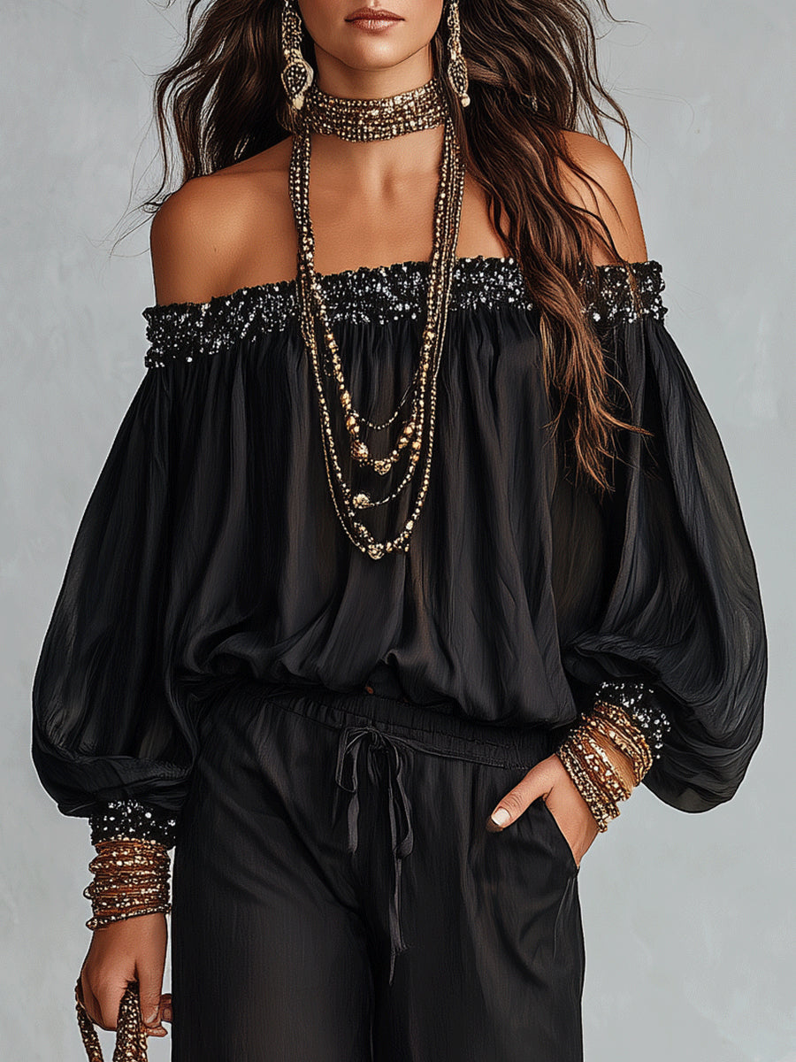 Daria | Conjunto compuesto por un top negro con hombros al aire y lentejuelas y unos pantalones anchos con cordón